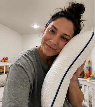 Mother holding a Ukola pillow
