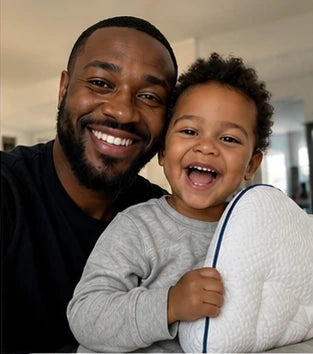Son and Dad holding a Ukola pillow