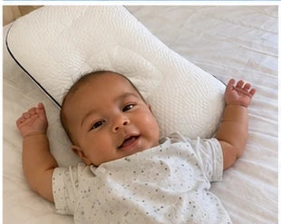 Child sleeping with ukola pillow