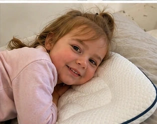 Child sleeping with ukola pillow